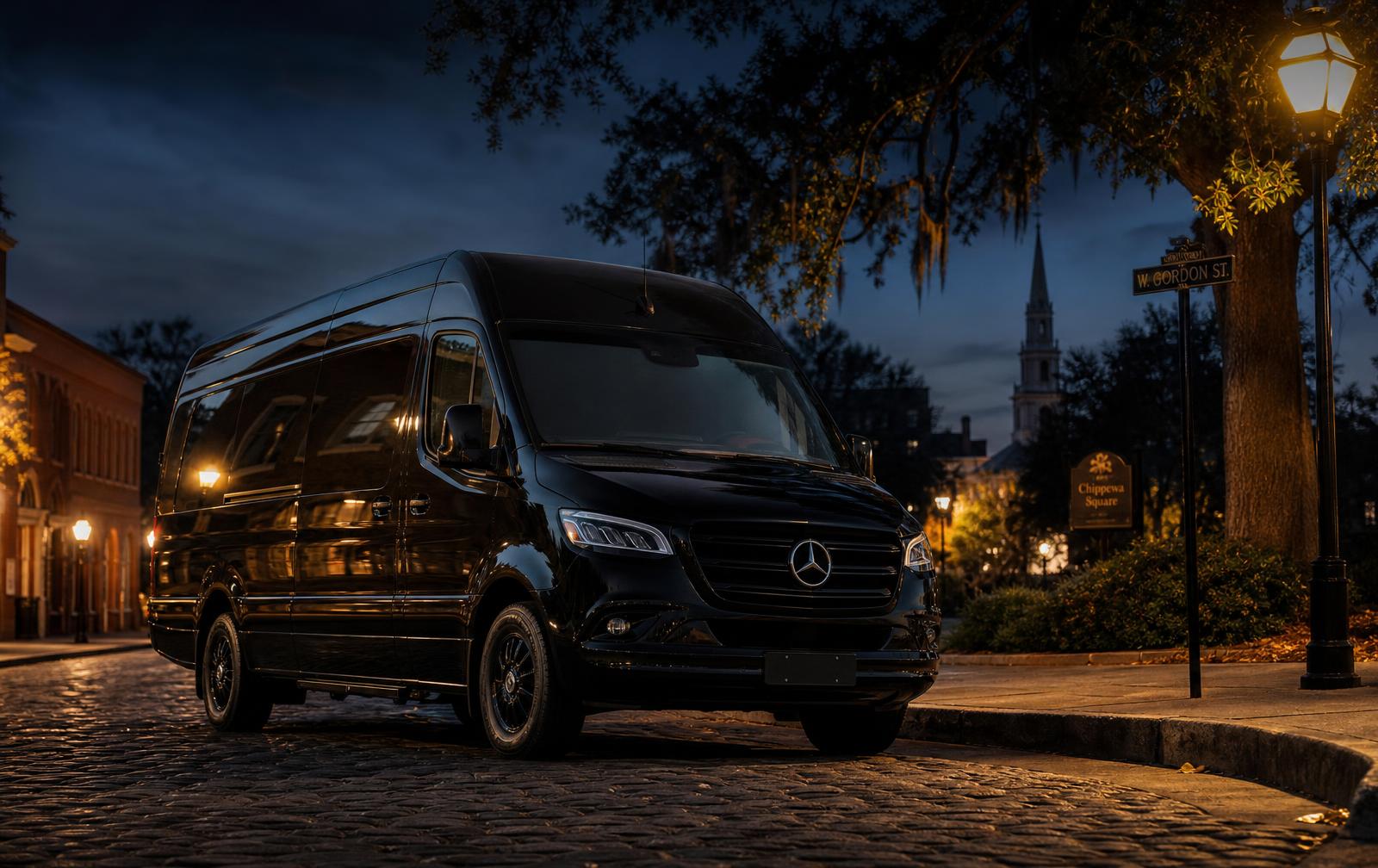 Black Mercedes-Benz Sprinter van at dusk