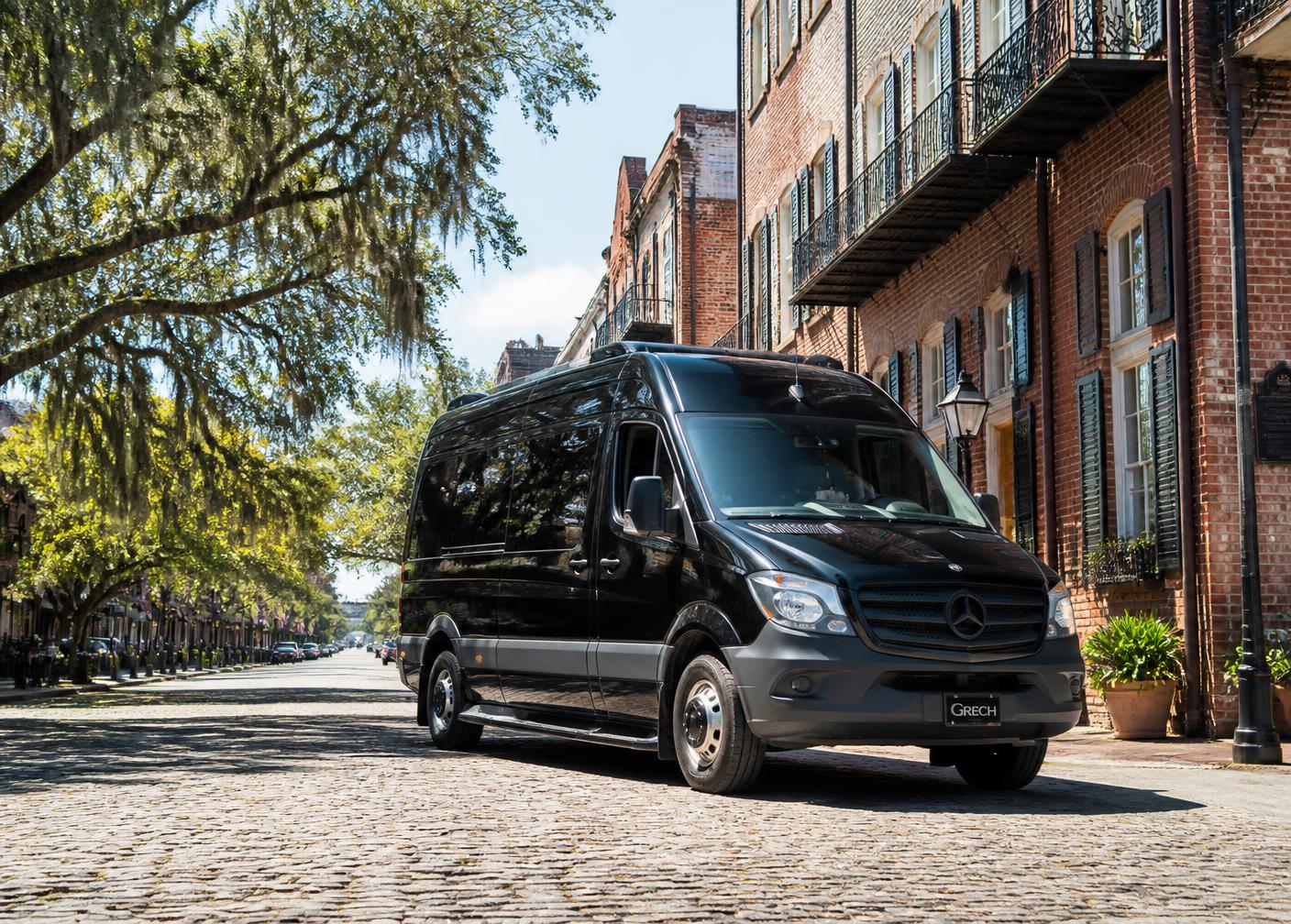 Black Mercedes-Benz Sprinter van on a downtown Savannah street